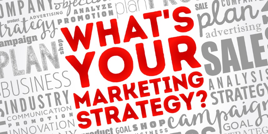 A background of a gray grid of marketing-related words and a red "What's Your Marketing Strategy?" stamped across it.